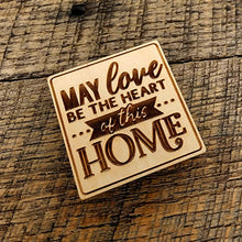 Load image into Gallery viewer, Magnet saying &quot;May Love Be The Heart of this Home&quot; tilted to the left

