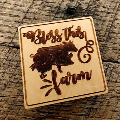 Magnet Inscribed with "Bless This Farm" also has a rooster, pig and cow beside one another